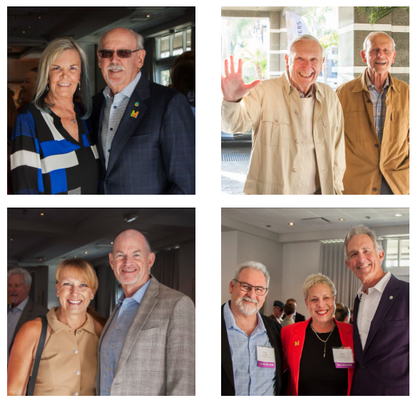 A collection of attendees smiling at an event.