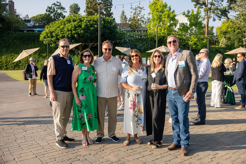 A group of people taking a photo at an event.