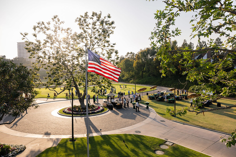 Aerial view of a park and an American flag