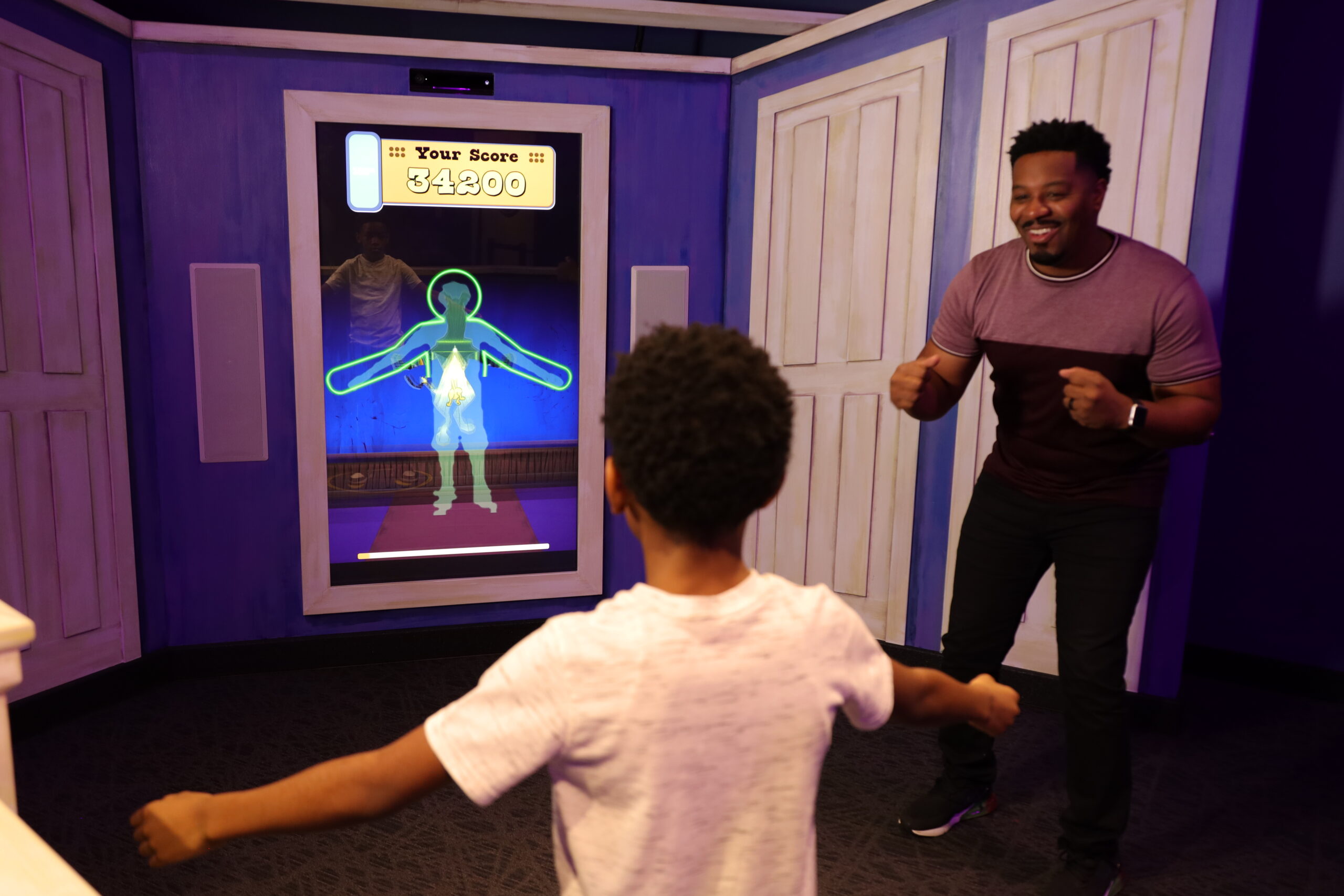 A family interacting with a museum exhibit.