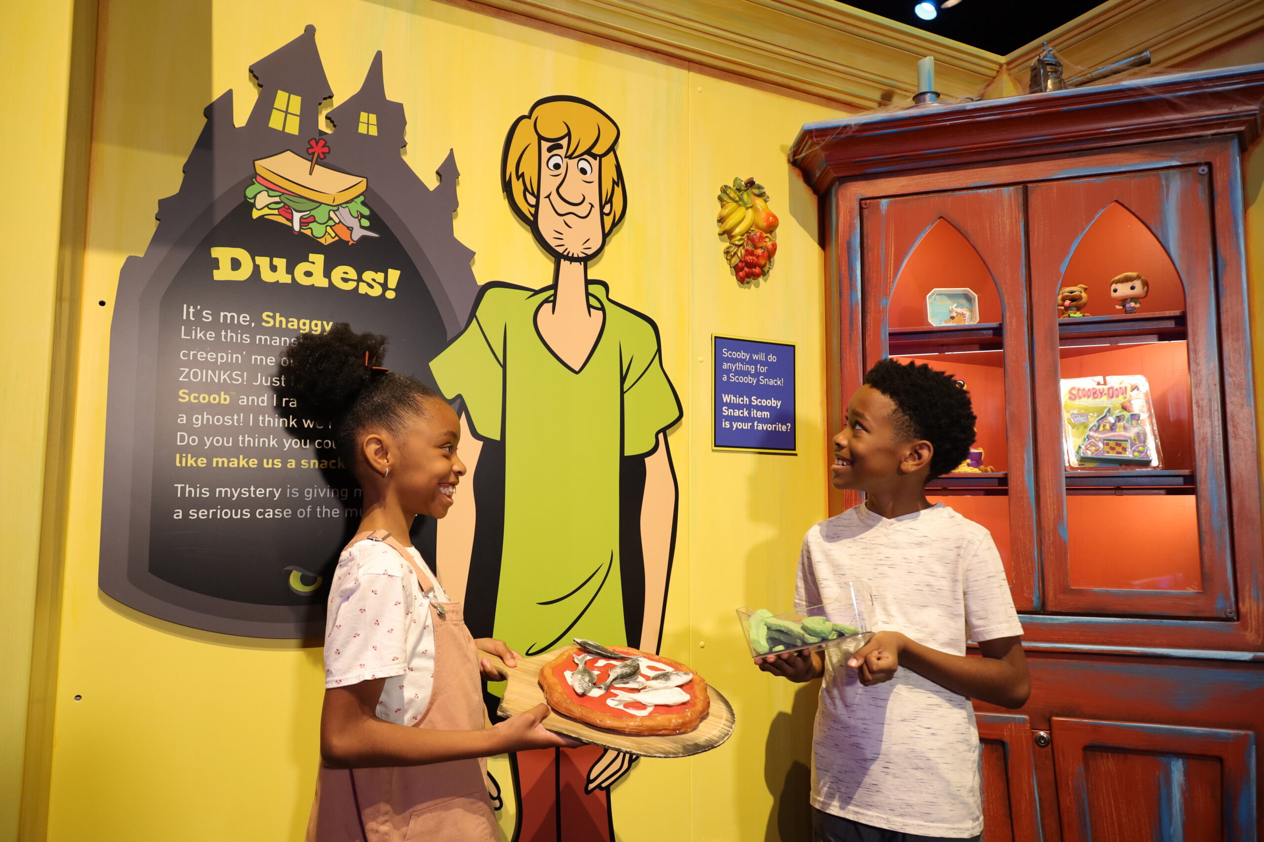 Kids interacting with a museum exhibit.